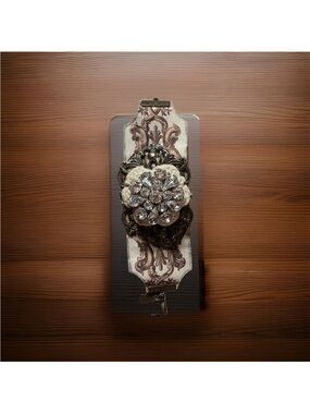 A Gilded Life Statement Bracelet with Crystal Floral Brooch